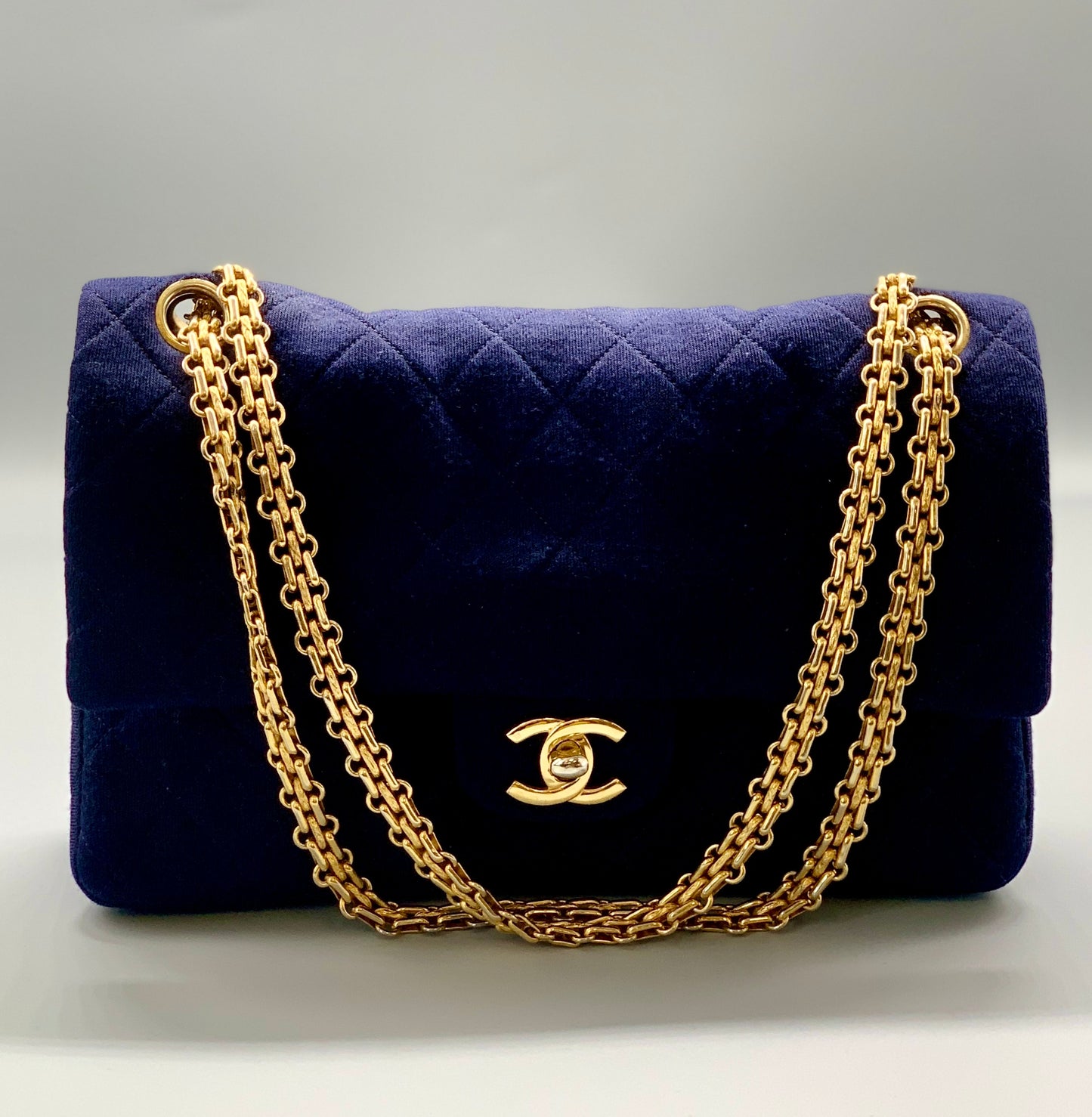 CHANEL Navy Jersey Quilted Flap Gold Hardware Handbag